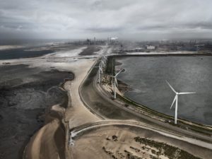 Wind turbines and industrial factory landscape. Edward Burtynsky Water
