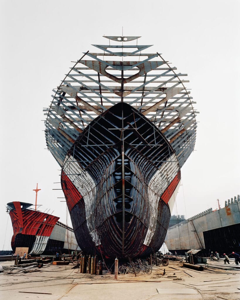 Massive half-constructed ship. Edward Burtynsky: Extraction / Abstraction.