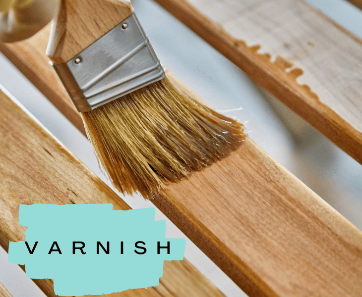 brushing a varnish on a wood