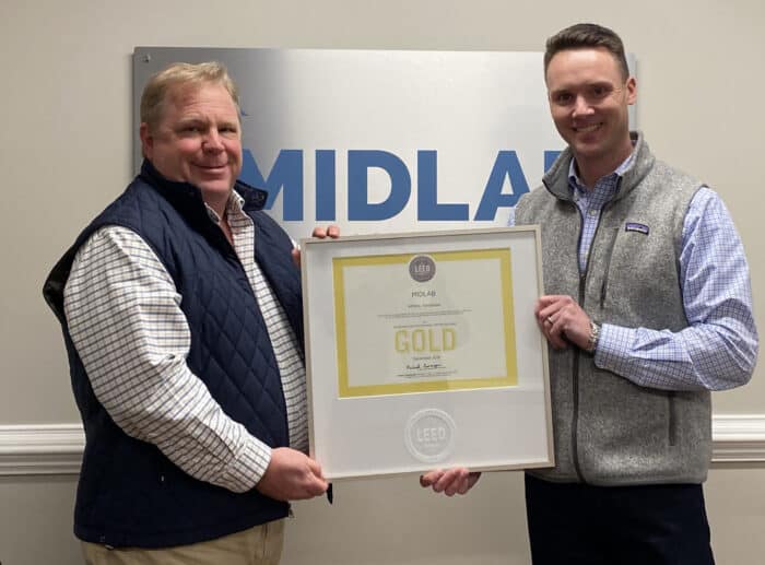 Matt Schenk and Matt Johnston pictured with Midlab's LEED Gold certification plaque