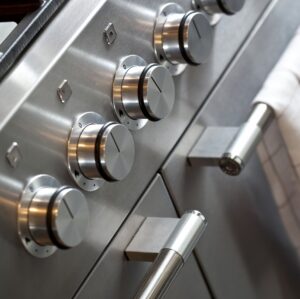 Close-up of stainless steel oven control knobs
