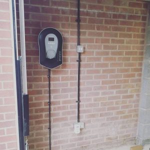 Myenergi Zappi EV Charging point mounted on wall in garage