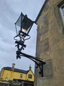 Angle looking up an electric antique gas lantern