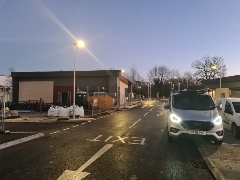Nulectrics van with the lamp post lights on in KFC Costa car park