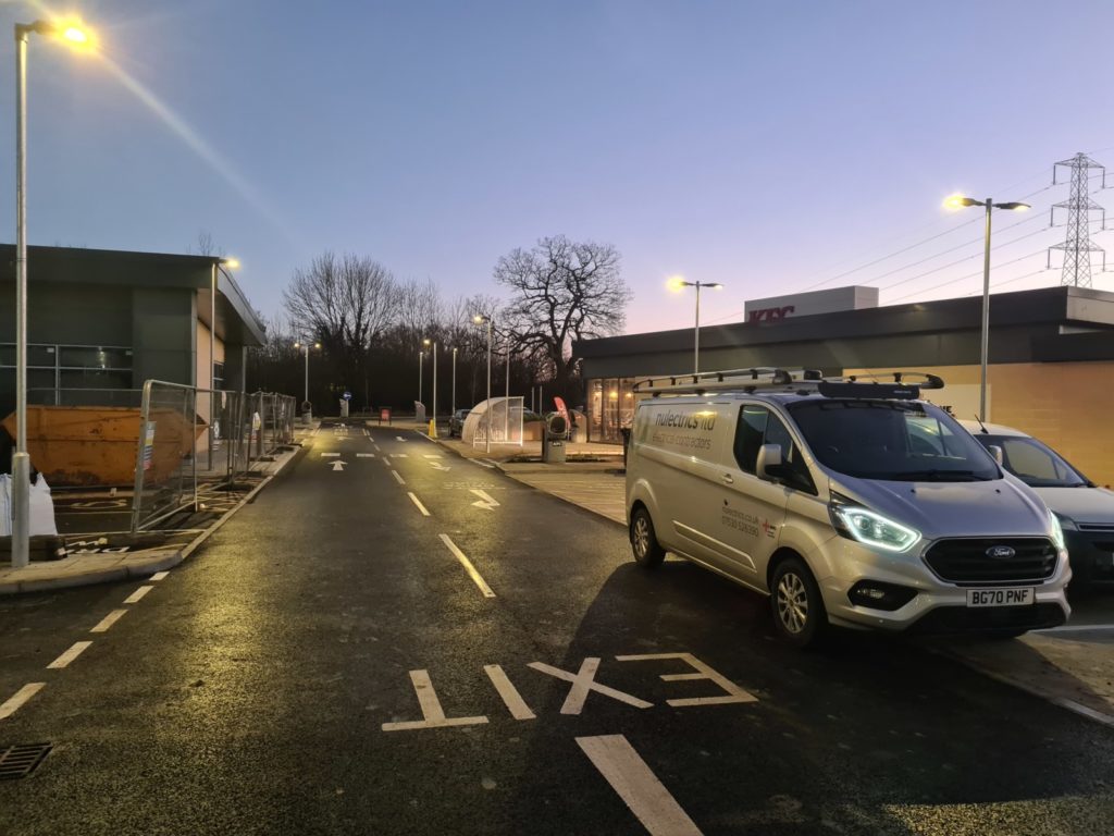 Nulectrics van with the lamp post lights on in KFC Costa car park