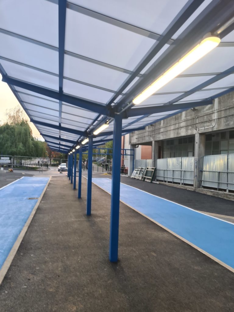 Close up of NVC LED battens installed on hospital canopy for energy-efficient lighting