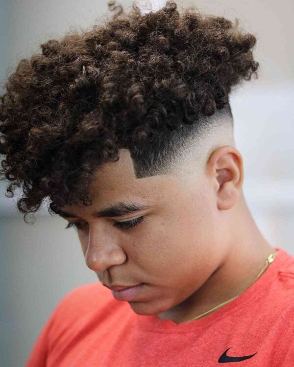 mid bald fade cut with a curly top for teen boys 600x750 1 Coupe de cheveux pour ado garçon : les tendances pour un look à la mode