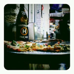 Wisconsin Craft Beer hinterland pale ale bomber and pizza at classic slice restaurant