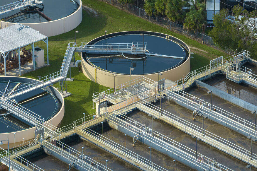 An aerial view of a city wastewater treatment plant. Hard water can wreak havoc on your commercial hot water system.
