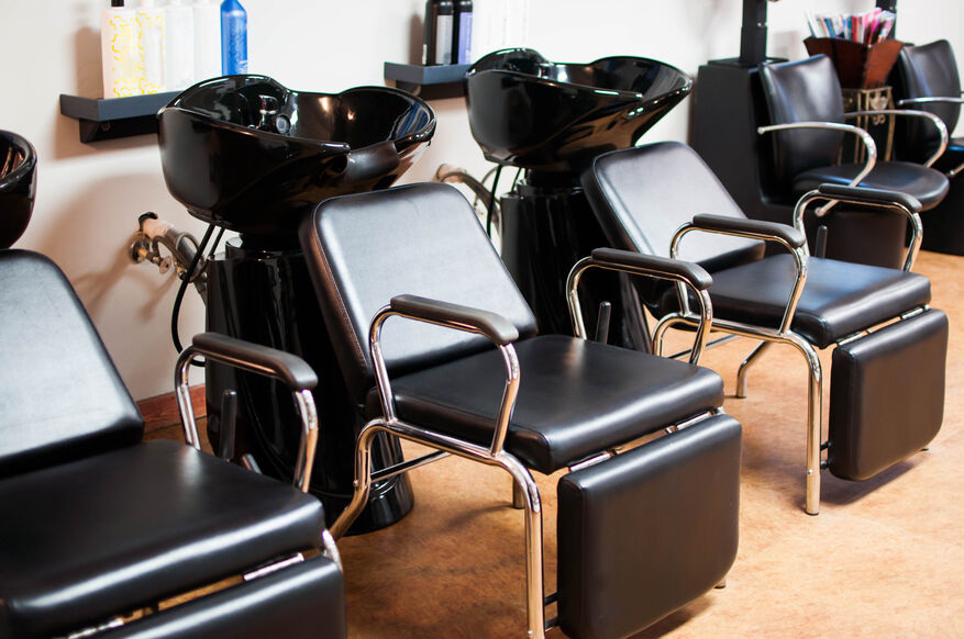 A row of salon hair-washing stations depends on reasonable hot water recovery rates to keep customers satisfied with their services. 