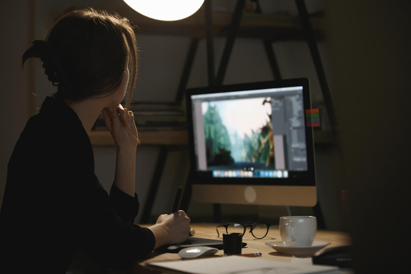 concentrated-young-lady-designer-night-using-computer (1)