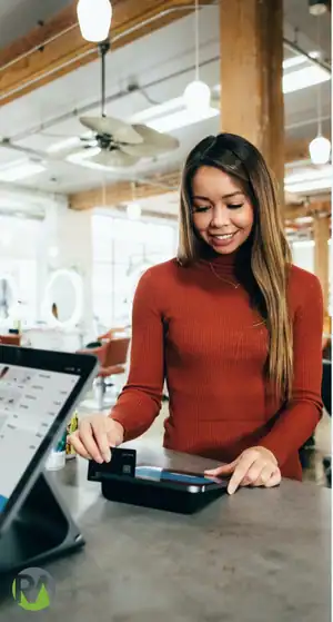 Woman using tablet for dynamic pricing analysis in retail setting.