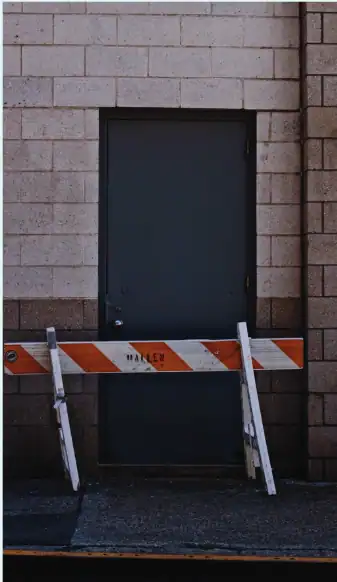 Doorway with construction barriers for security and access control.