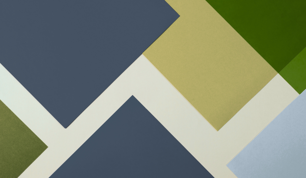 Modern geometric logo for Revology Analytics, data-driven solutions provider.