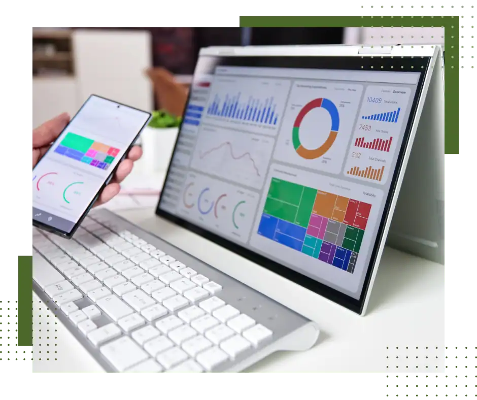 Business analytics dashboard with charts on computer and mobile device.