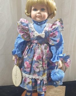 Porcelain doll with dimples by elizabeth gray