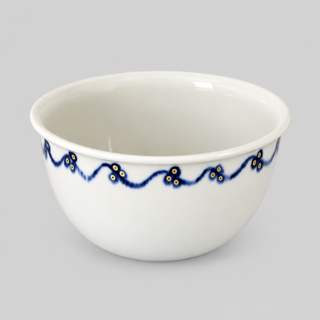 Hvid porcelæns skål med blå og gule blomsterdekoration.