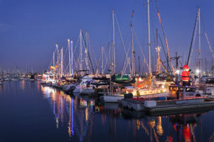 Dozens of brightly lit ships docked in Channel Islands Harbor for the Parade of Lights