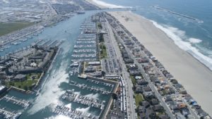 Aerial view of the sun-drenched harbor, light chop across the water