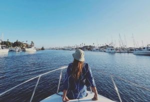 woman on boat in harbor