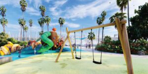 Family-friendly playground near Channel Islands Harbor with palm trees and marina views.