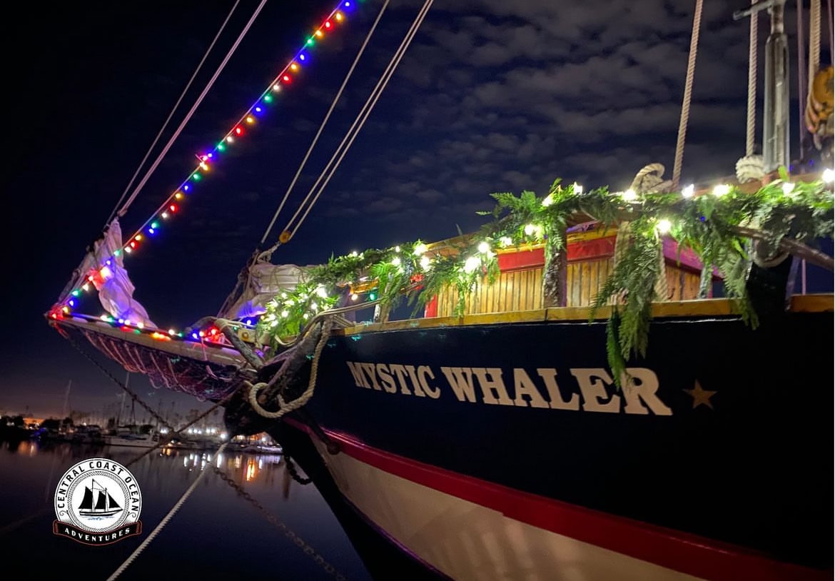 Beautiful decorated boat at night with festive lights in Channel Islands Harbor.