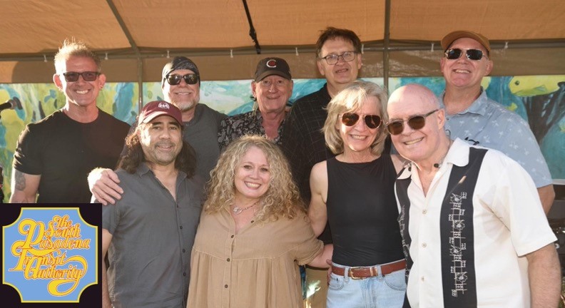 A group of nine adults pose together outdoors under a tent, smiling at the camera. A logo in the corner reads, 9th Annual Richardson Piano Authority.