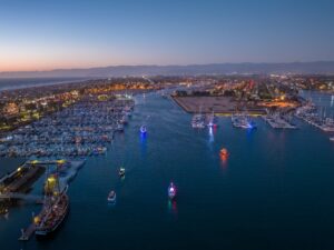 Aerial view of Channel Islands Harbor with boats and docks at dusk.