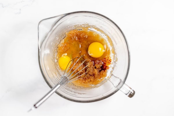 a bowl with wet ingredients for gluten free pumpkin bars