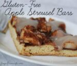 Image shows a gluten-free apple streusel bar on a white plate drizzled in icing. Text reads "Gluten-Free Apple Streusel Bars"