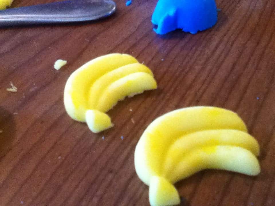 Image shows a close up of yellow banana bunches made from play dough
