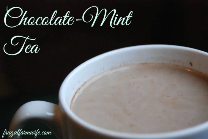 Image shows a close up shot of the top of a coffee cup filled with liquid and text that reads "chocolate-mint tea"