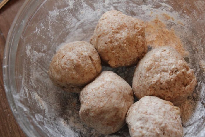 Image shows balls of spelt tortilla mix in a bowl