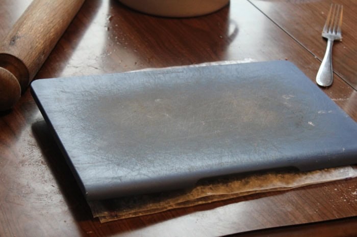 Photo shows a tortilla press on a table