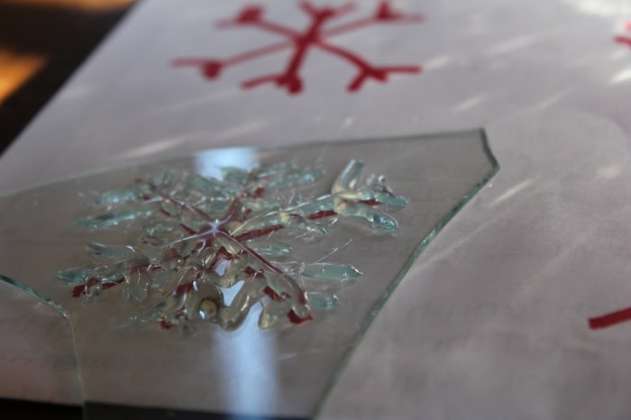 Image shows a glue snowflake on glass 