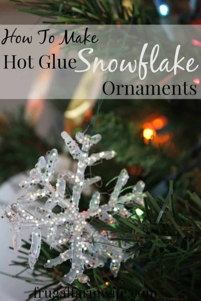 Image shows a snowflake ornament in a tree with text that reads "How to Make Hot Glue Snowflake Ornaments"