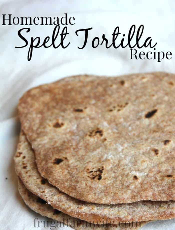 Image shows a close up of spelt tortillas with the text "Homemade Spelt Tortilla Recipe"