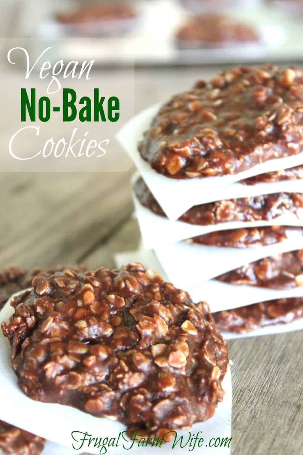 Images shows a stack of vegan no-bake cookies separated by parchment paper, on a countertop. Text overlay reads "Vegan No-Bake Cookies"