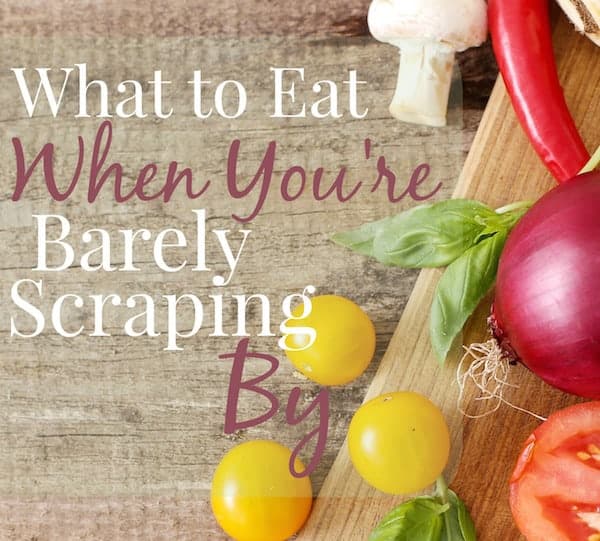 Image shows a cutting board with several fresh vegetables on it. Text reads "What to Eat When You're Barely Scraping By"