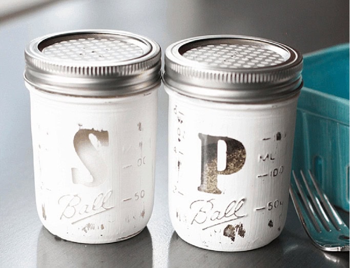 Photo shows mason jars as salt and pepper shakers on a counter.