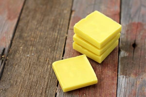 Image shows several homemade lotion bars on a table