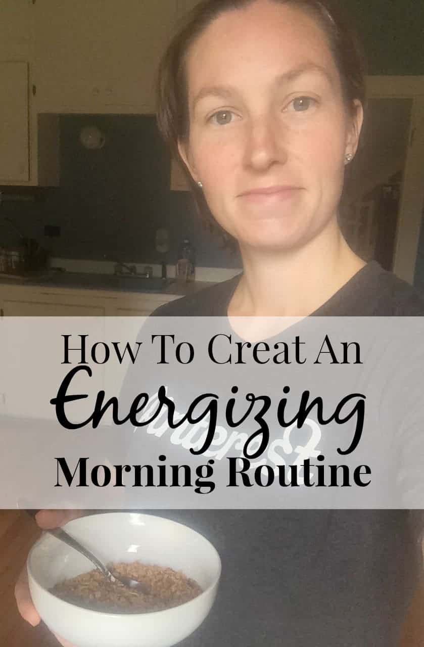 Image shows a woman looking at a camera inside a kitchen with a slight smile holding a bowl of cereal. Text overlay reads "How to Create and Energizing Morning Routine"