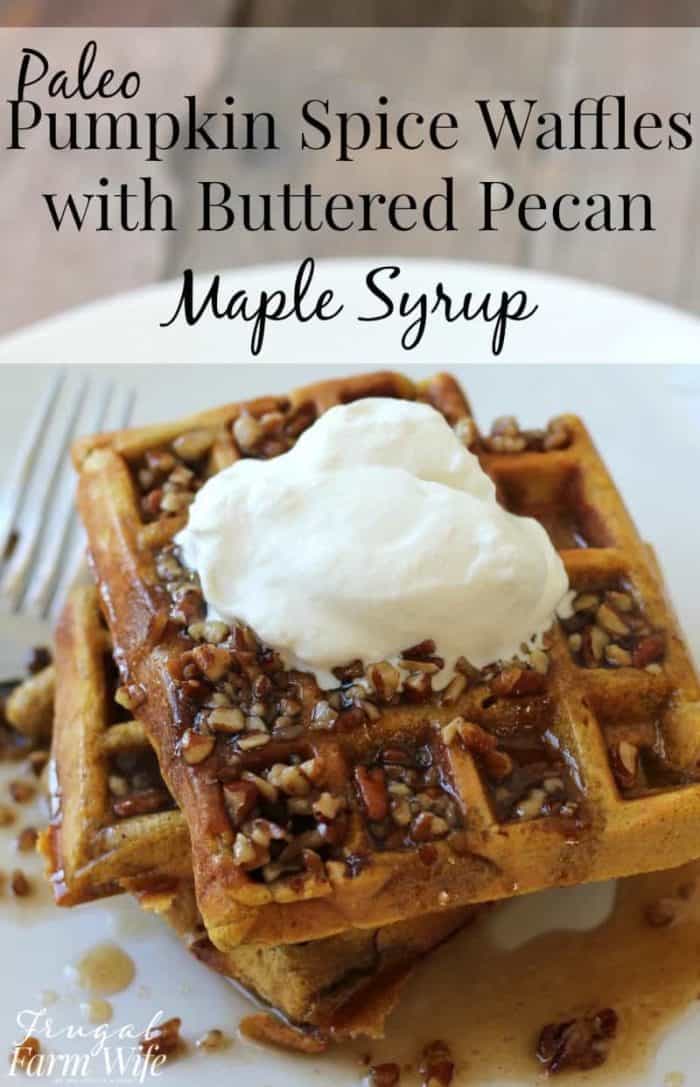 Image shows a plate of waffles covered in nuts, syrup and whipped cream with text that reads "Paleo Pumpkin Spice Waffles with Buttered Pecan Maple Syrup"