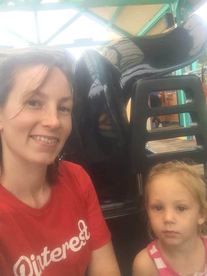 Image shows a woman with a small child on a whale ride