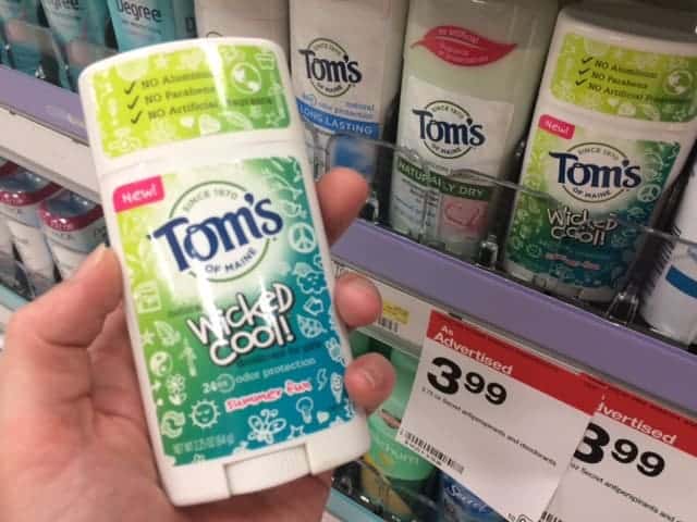 Image shows a hand holding a Tom's of Maine Wicked Cool deodorant in the aisle of a Target store. Behind the hand is a row of more Tom's of Maine deodorants.
