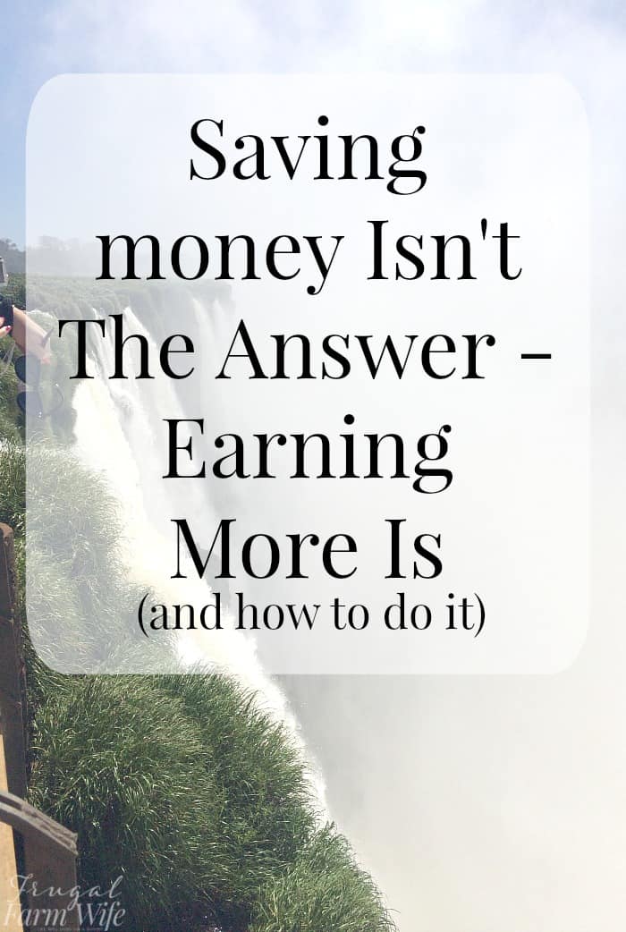 Image shows a photo of a waterfall on a sunny day, with text overlay that reads "Saving money isn't the answer- earning more is (and how to do it)"