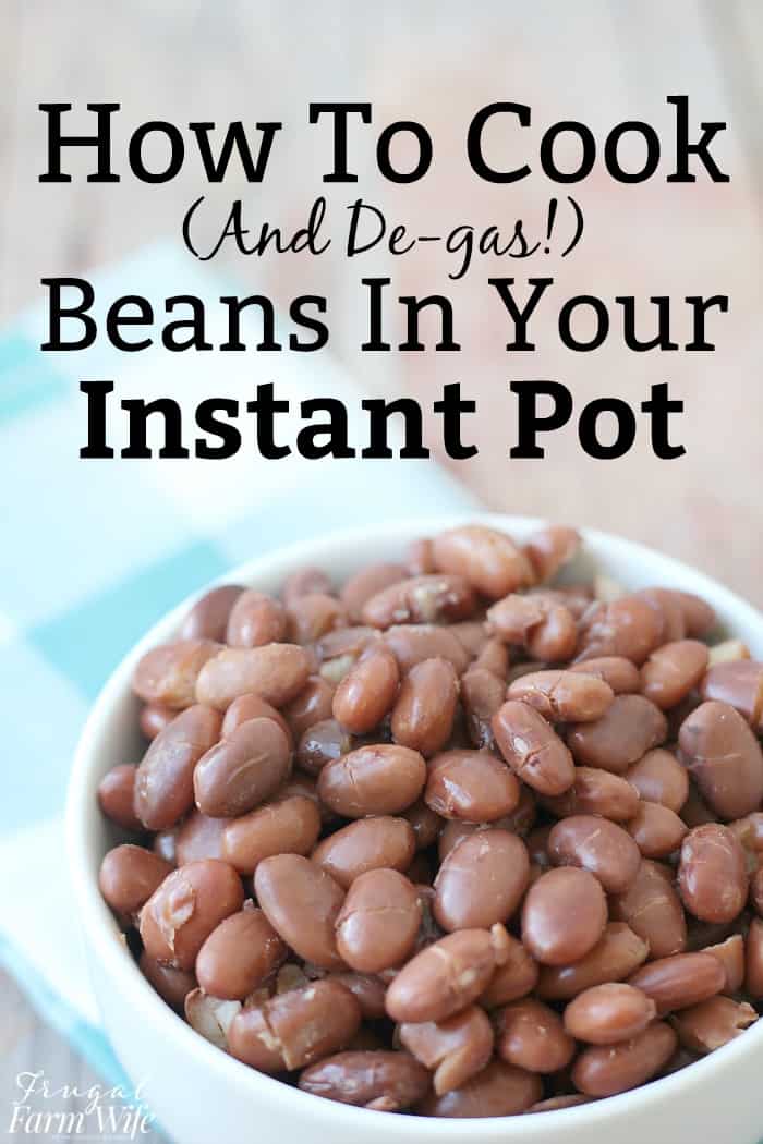 Image shows a close up of a large bowl of cooked pinto beans. Text above reads "How to cook and de-gas beans in your instant pot"