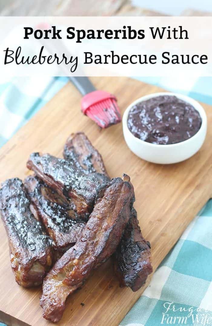 Image shows a cutting board with spare ribs and bbq sauce with text that reads "Pork Spareribs with Blueberry Barbecue Sauce"