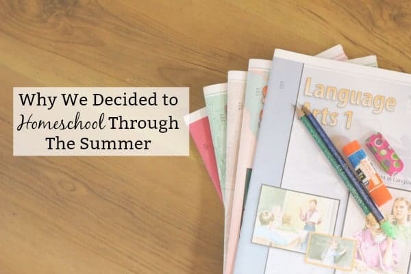 Images shows several small workbooks for first grade fanned on a table. Two pencils, an eraser and gluestick sit on top. Text reads "Why We Decided to Homeschool Through The Summer"