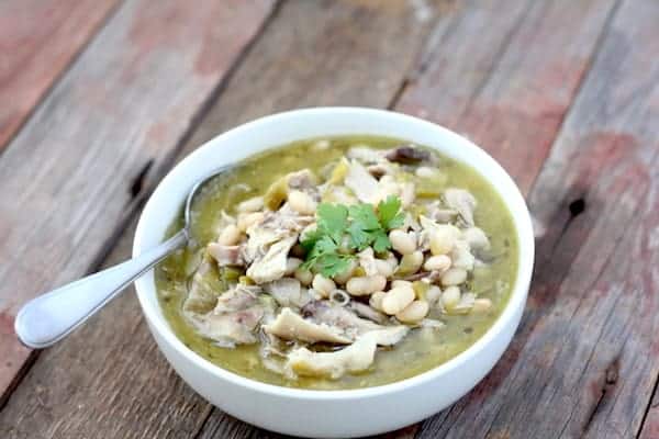 Image shows a bowl of white chili on a table